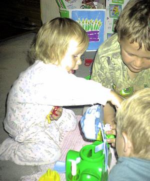 Sianna's 2nd birthday, Daniel & Nathan helping her with her toys. 23 May 00
