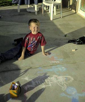 Nathan on the back patio with chalk, 7 May 2000